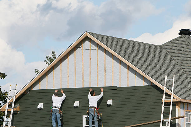 Professional Storm Damage Siding Repair technician working in Smithfield, VA